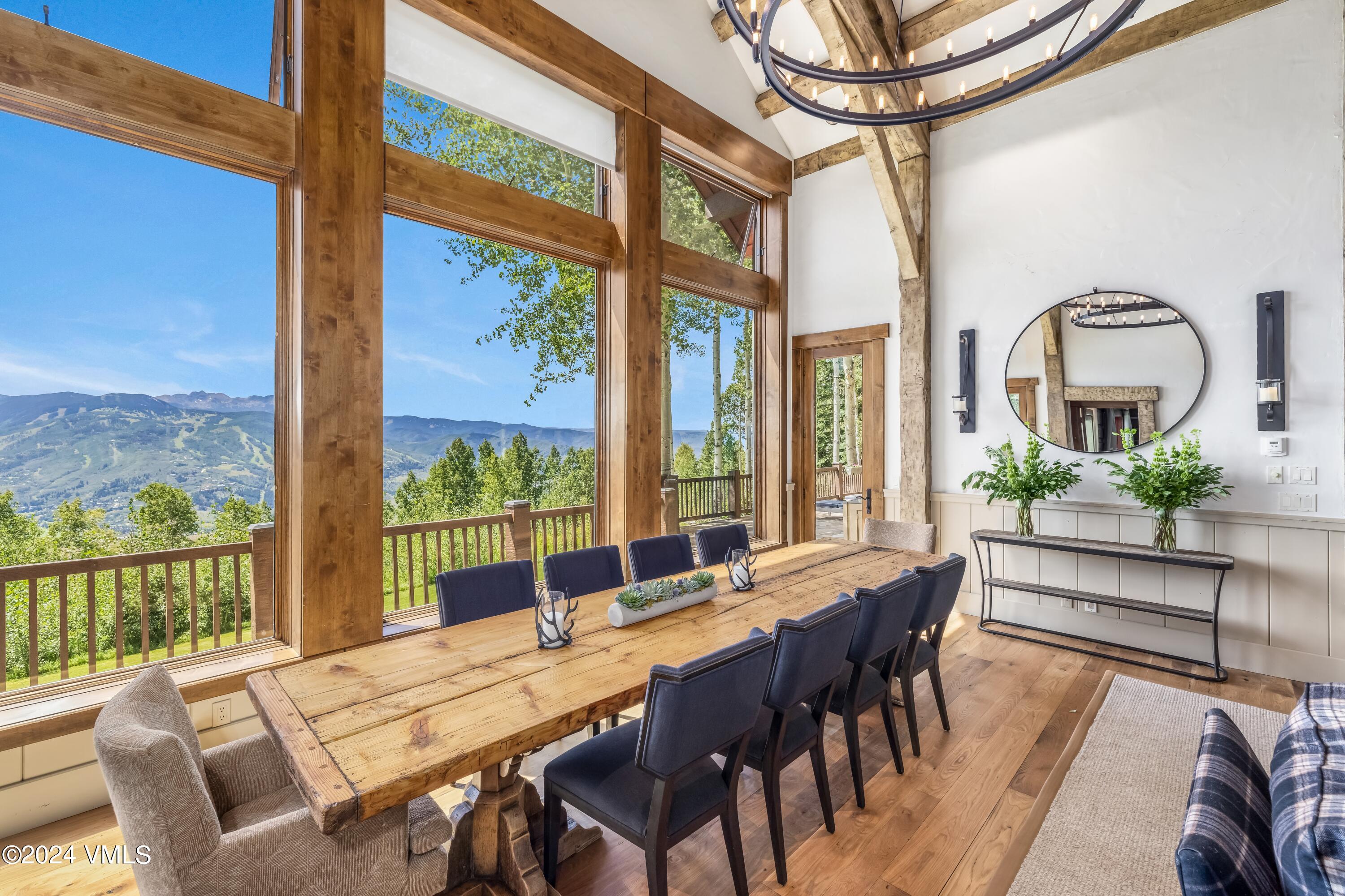 48 Jasmine Avon, CO 81620 - Photo 10 of 67 a view of a dining room with furniture large windows and wooden floor