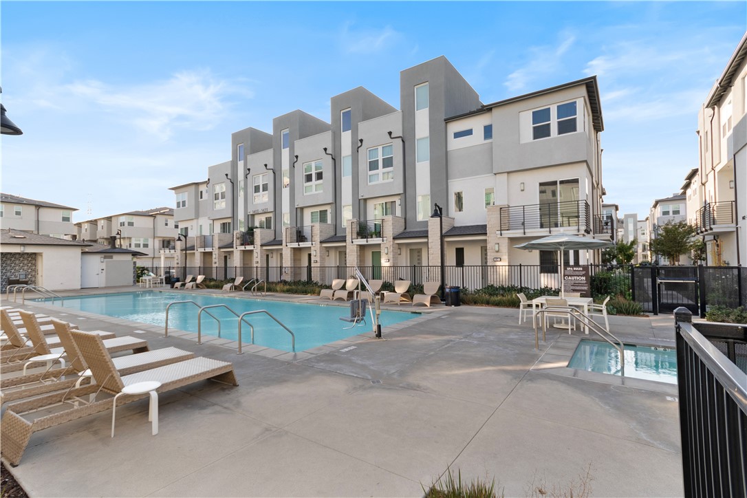 1215 West Bushell Street Anaheim, CA 92805 - Photo 12 of 24 a city view with tall buildings and cars park in front of it