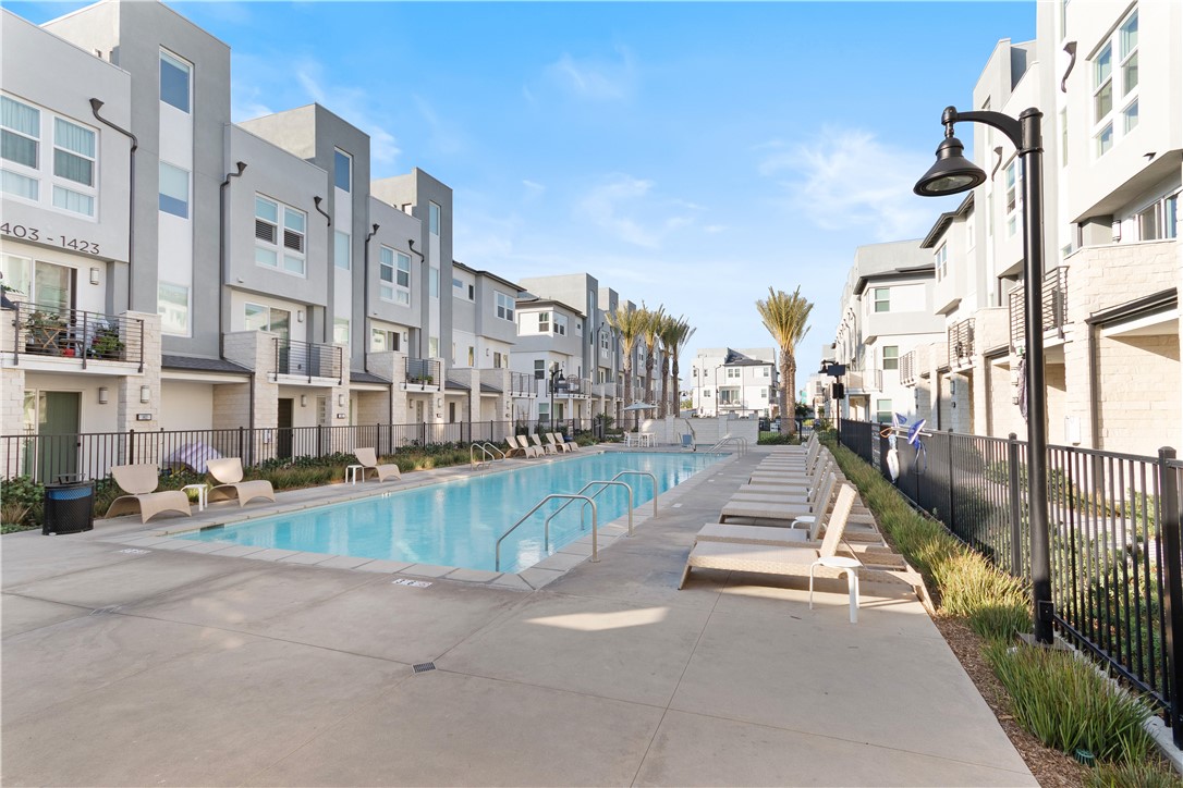 1215 West Bushell Street Anaheim, CA 92805 - Photo 13 of 24 a view of a swimming pool in front of buildings