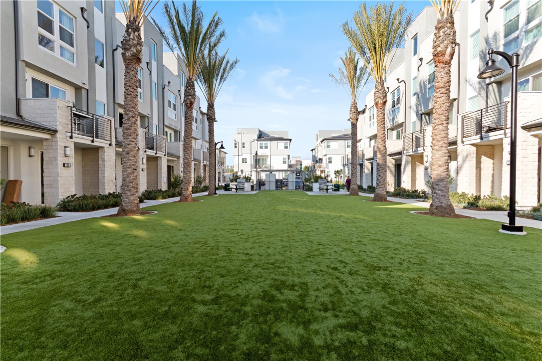 1215 West Bushell Street Anaheim, CA 92805 - Photo 16 of 24 a view of a apartment with a big yard and large trees