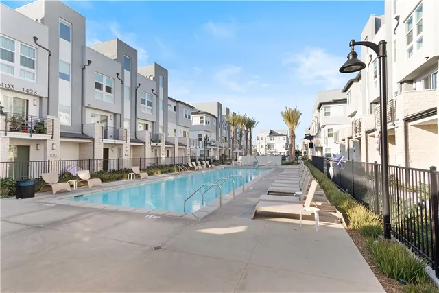 a view of a swimming pool in front of buildings