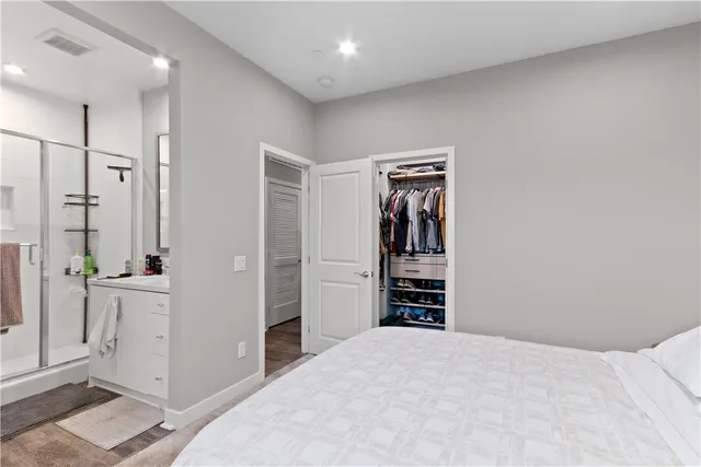 a view of a bedroom with closet