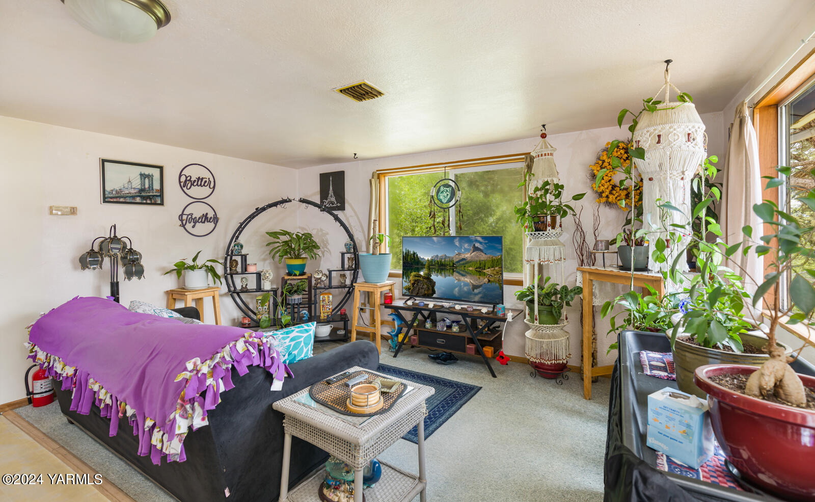1690 Trails Road East Belfair, WA 98528 - Photo 17 of 22 a bedroom with bed and a potted plant