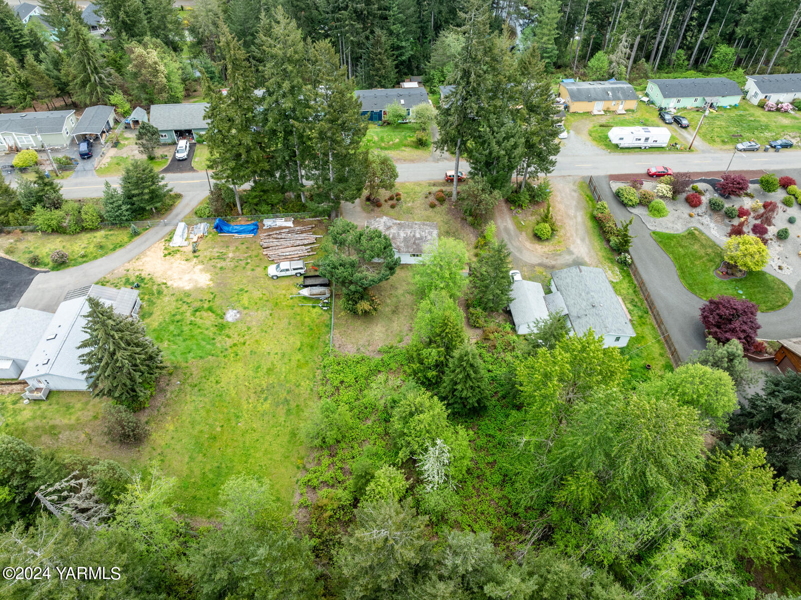 1690 Trails Road East Belfair, WA 98528 - Photo 7 of 22 an aerial view of residential houses with outdoor space and trees all around