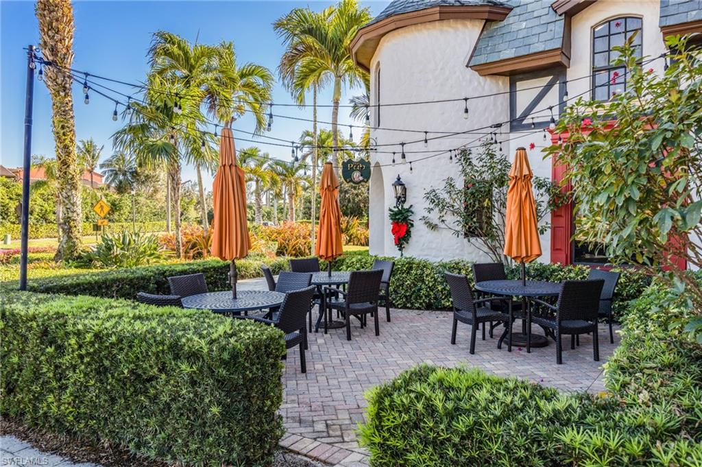 9128 Delano Street, Unit 892 Naples, FL 34113 - Photo 43 of 49 an outdoor view with patio
