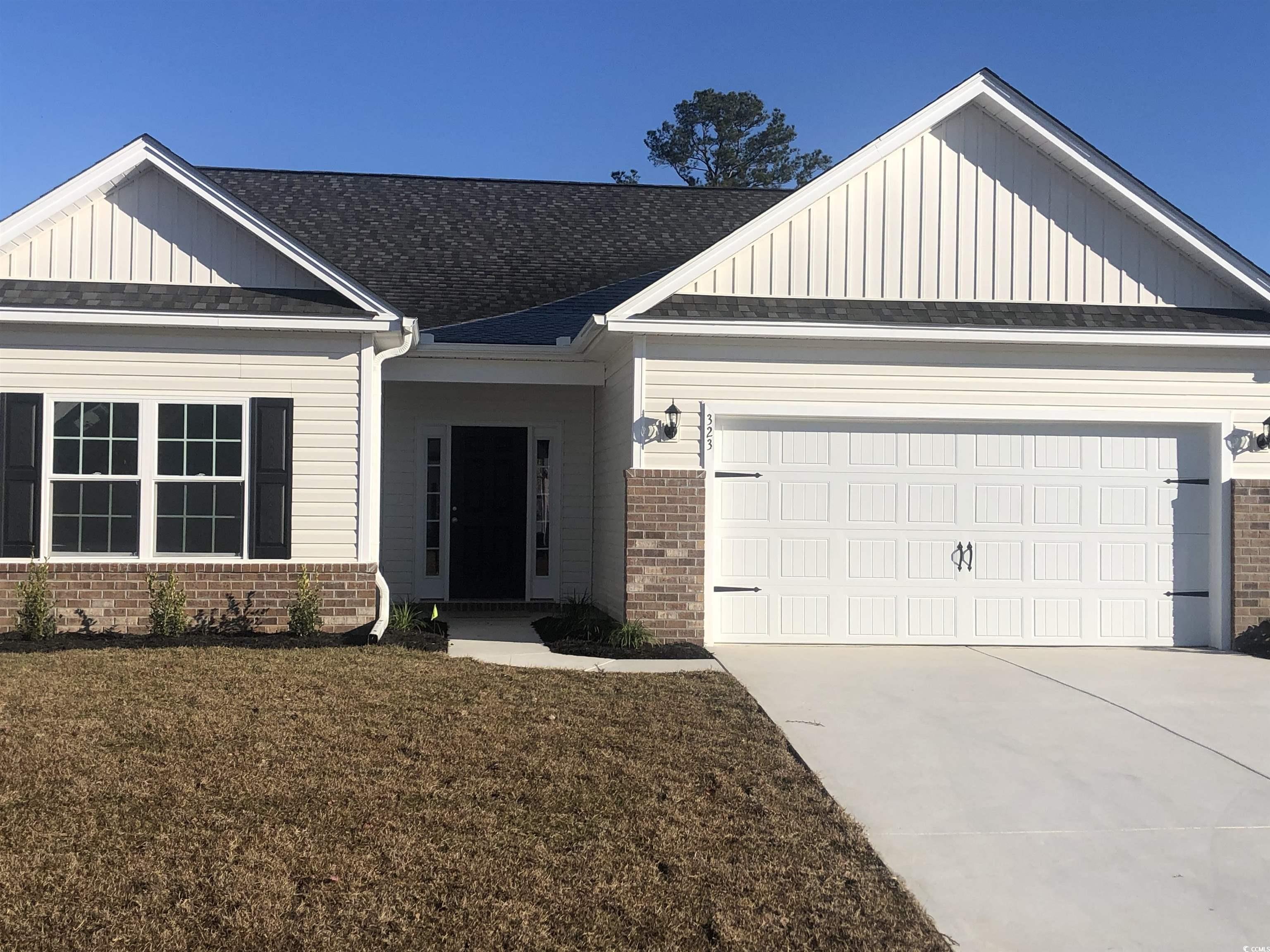 323 Lakota Loop Longs, SC 29568 - Photo 1 of 19 View of front of house featuring a garage and a fr
