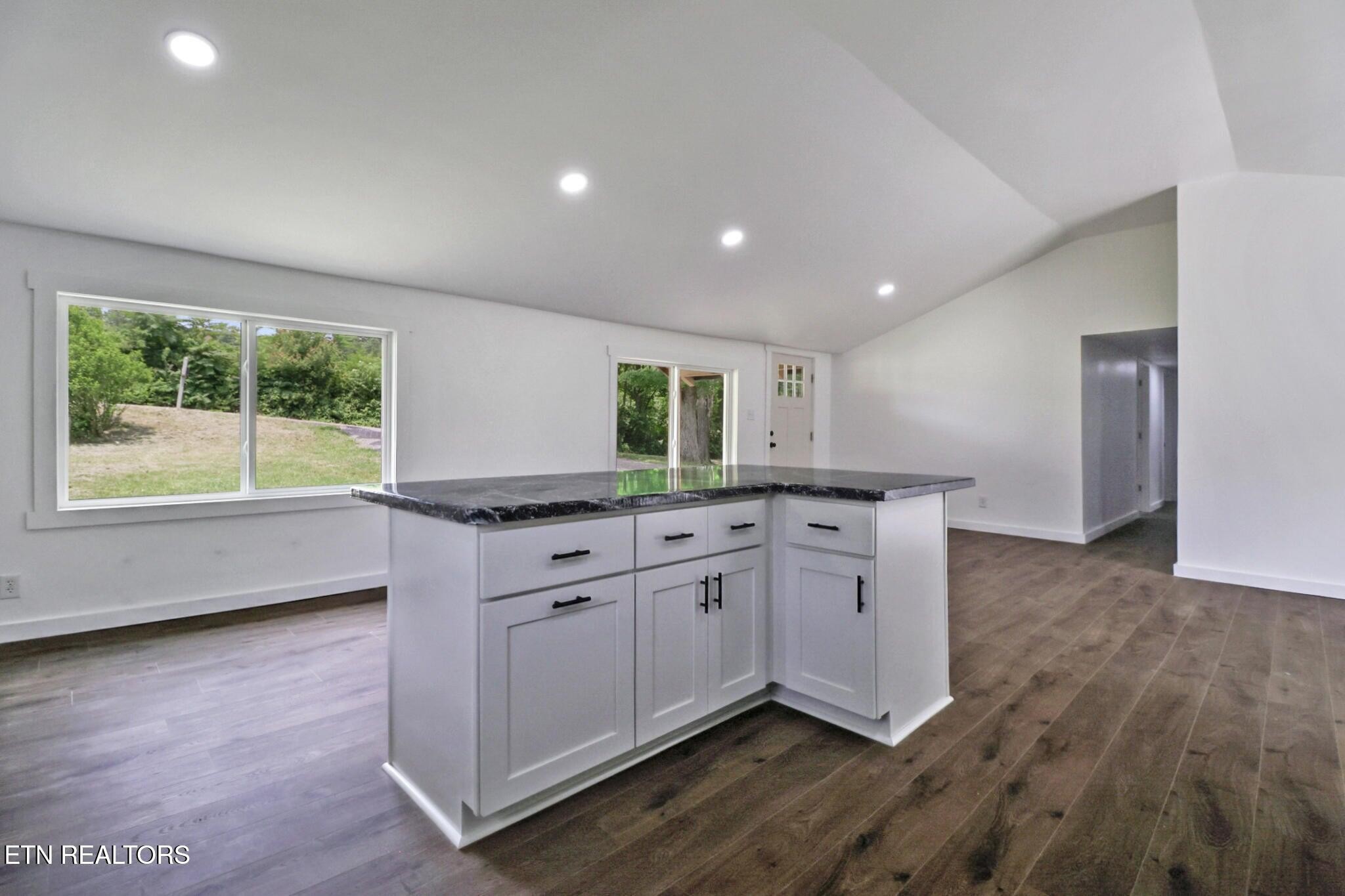 1095 Franklin Road Jamestown, TN 38556 - Photo 19 of 31 a kitchen with stainless steel appliances granite countertop a stove a sink and a large window
