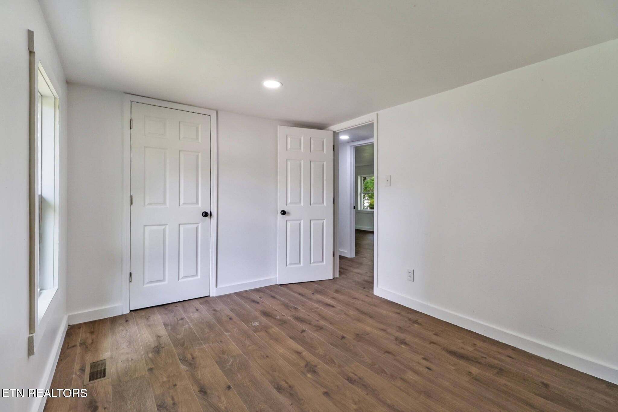 1095 Franklin Road Jamestown, TN 38556 - Photo 24 of 31 a view of an empty room with wooden floor