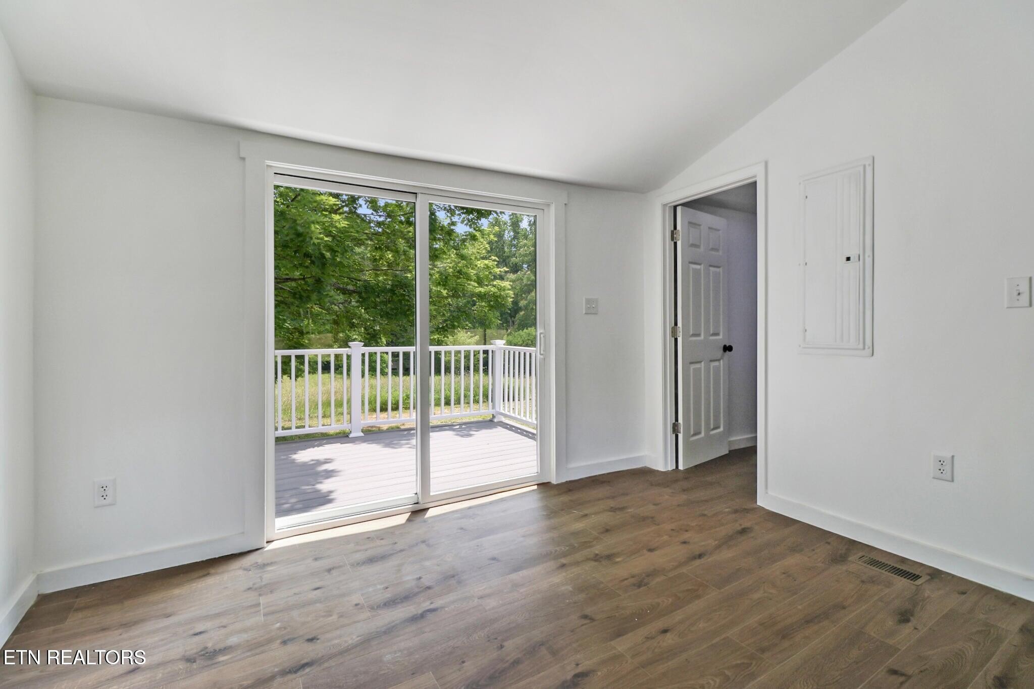 1095 Franklin Road Jamestown, TN 38556 - Photo 30 of 31 a view of empty room with wooden floor and fan