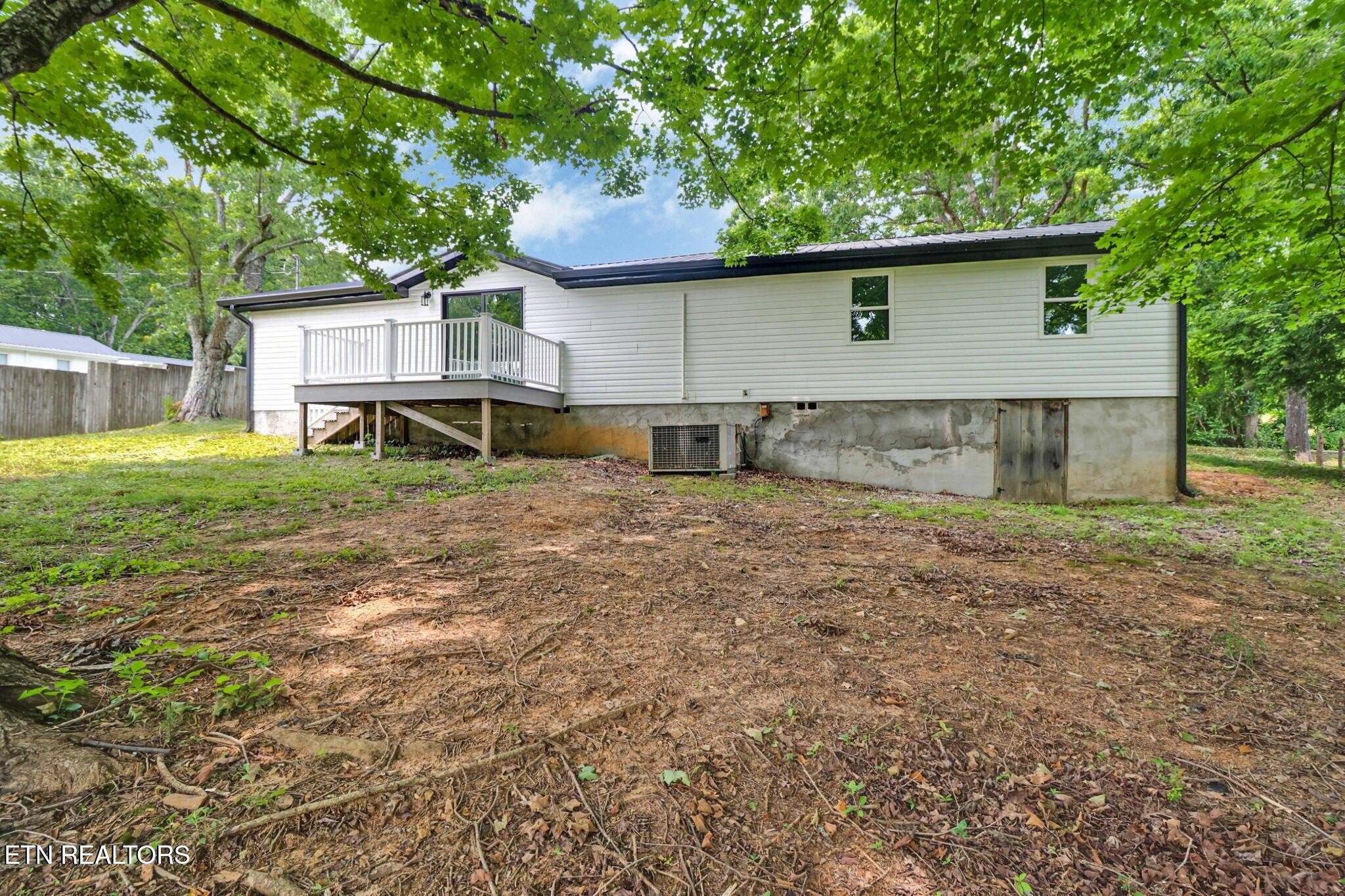 1095 Franklin Road Jamestown, TN 38556 - Photo 8 of 31 a view of a house with a yard and sitting area