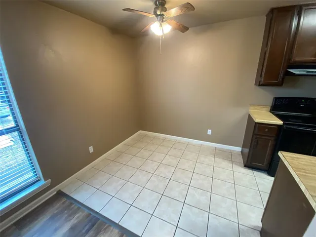 a view of an empty room and wooden floor