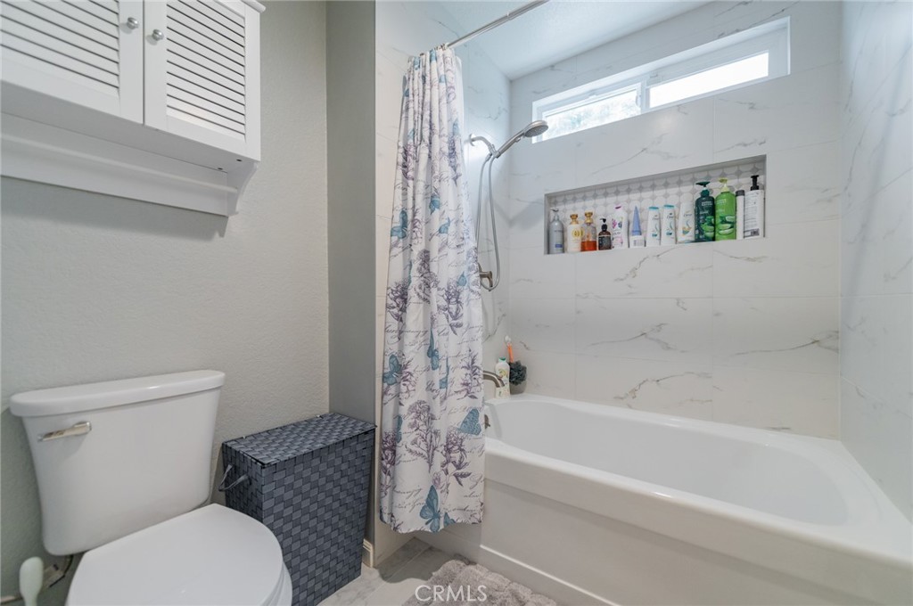 23 Country Ridge Road Phillips Ranch, CA 91766 - Photo 20 of 45 a bathroom with a toilet and a bathtub