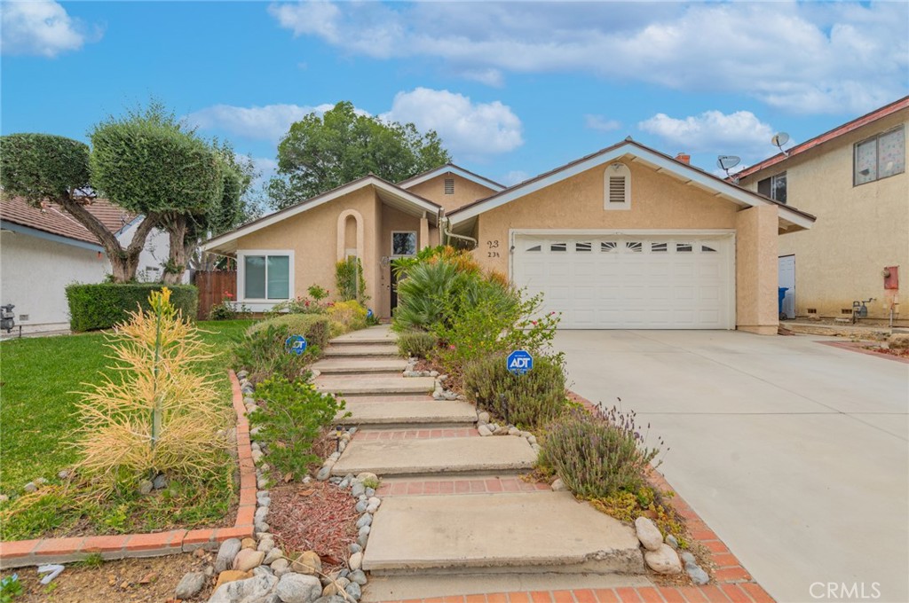 23 Country Ridge Road Phillips Ranch, CA 91766 - Photo 2 of 45 a view of a house with a yard and potted plants