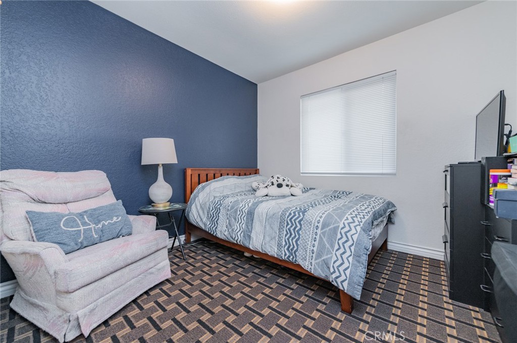 23 Country Ridge Road Phillips Ranch, CA 91766 - Photo 21 of 45 a bedroom with a bed and a couch