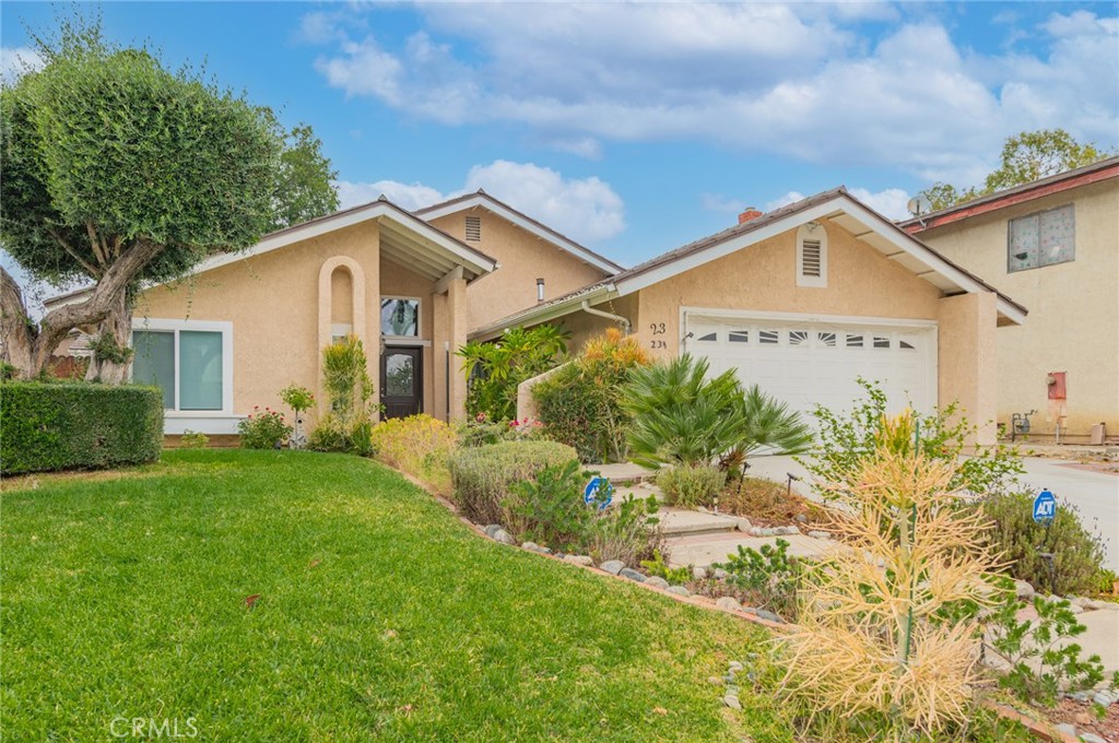 23 Country Ridge Road Phillips Ranch, CA 91766 - Photo 3 of 45 a front view of a house with garden