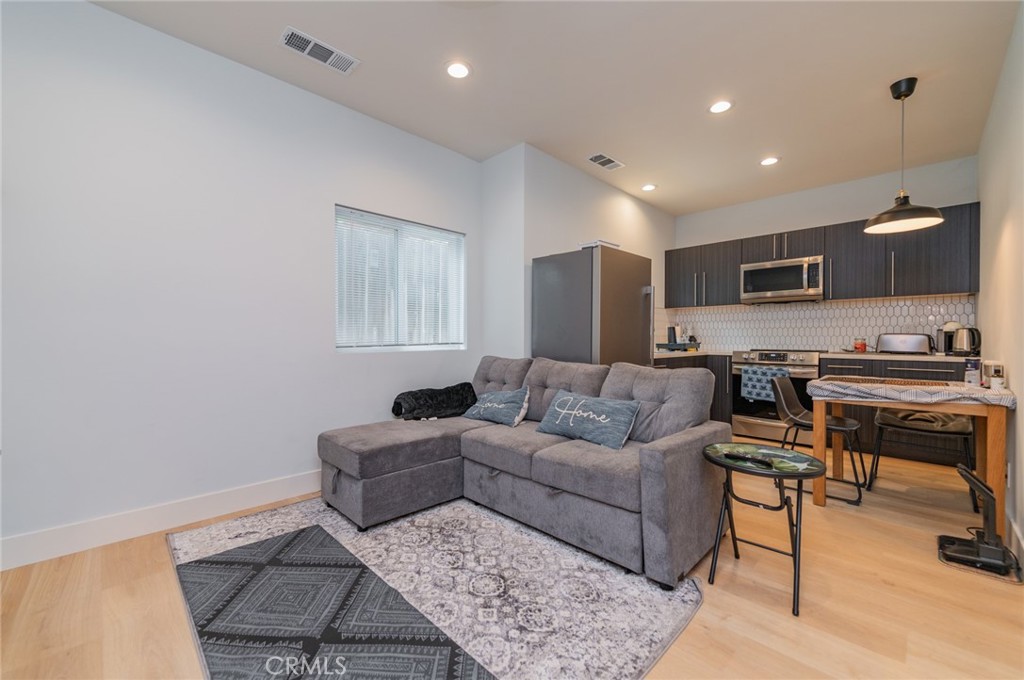 23 Country Ridge Road Phillips Ranch, CA 91766 - Photo 31 of 45 a living room with furniture and a wooden floor