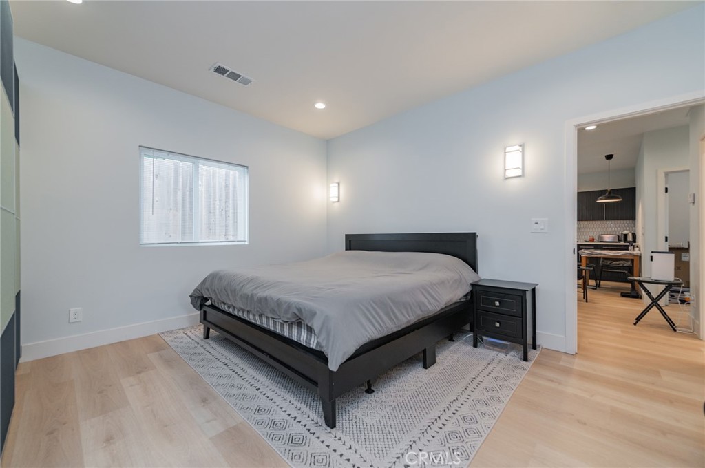 23 Country Ridge Road Phillips Ranch, CA 91766 - Photo 34 of 45 a spacious bedroom with a bed and a table in it