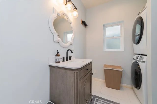 a bathroom with a toilet mirror and vanity