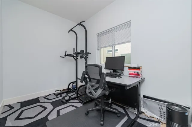 a view of a workspace with furniture