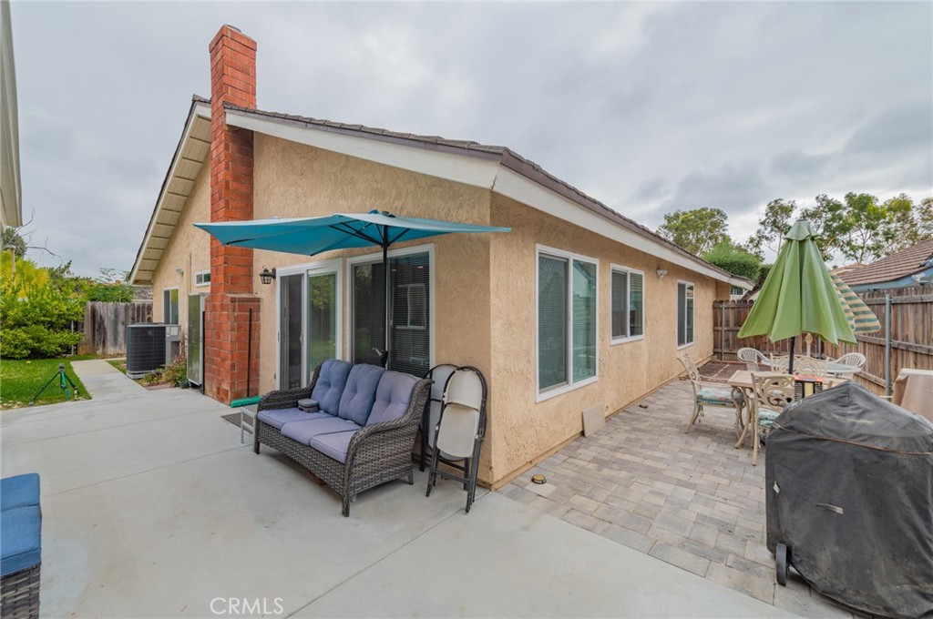 23 Country Ridge Road Phillips Ranch, CA 91766 - Photo 42 of 45 a view of a house with a patio and a yard