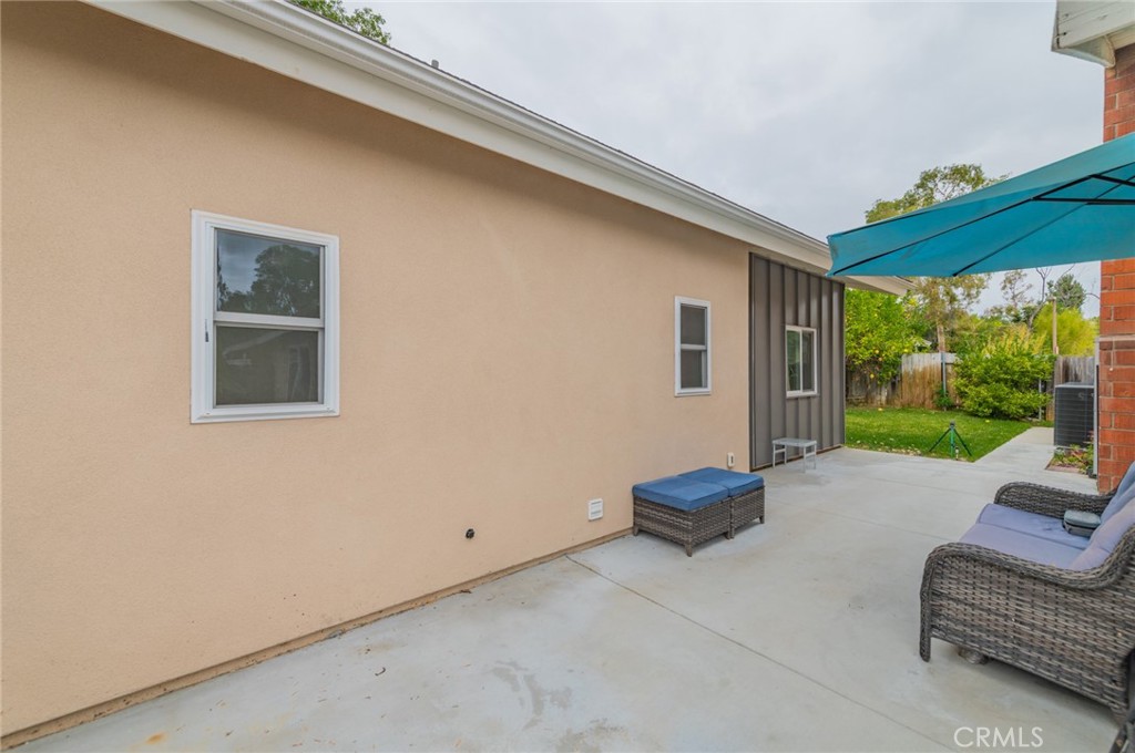 23 Country Ridge Road Phillips Ranch, CA 91766 - Photo 43 of 45 a living room with furniture and a floor to ceiling window