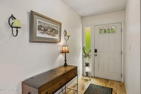 a view of an entryway with wooden floor