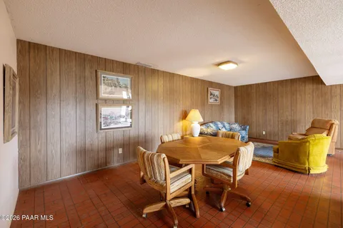 a dining room with furniture and wooden floor
