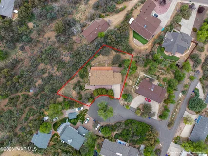 an aerial view of house with yard