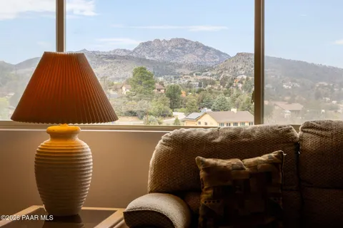 a living room with couches and a large window