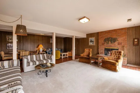 a living room with furniture gym equipment and a view of living room