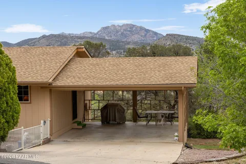 a view of a car park in front of house