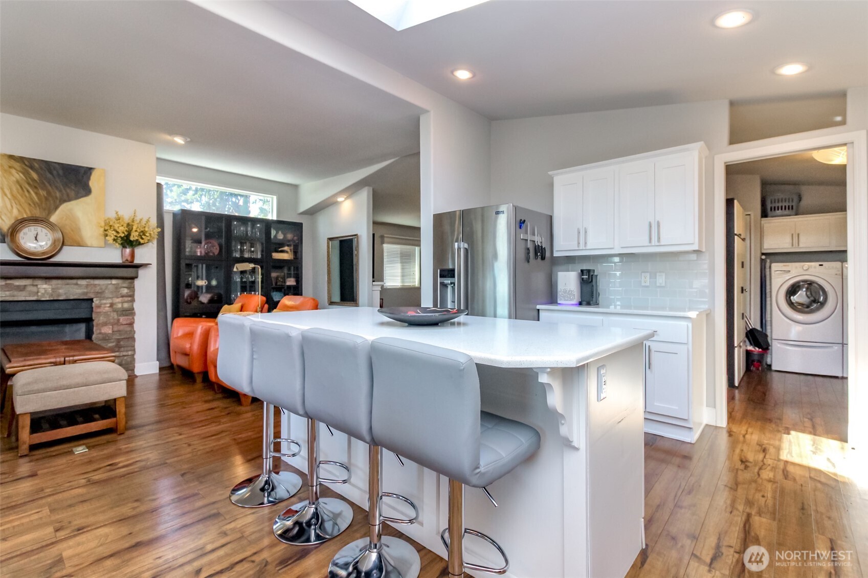 2101 South 324th Street, Unit 11 Federal Way, WA 98003 - Photo 8 of 40 a kitchen with a table chairs refrigerator and cabinets