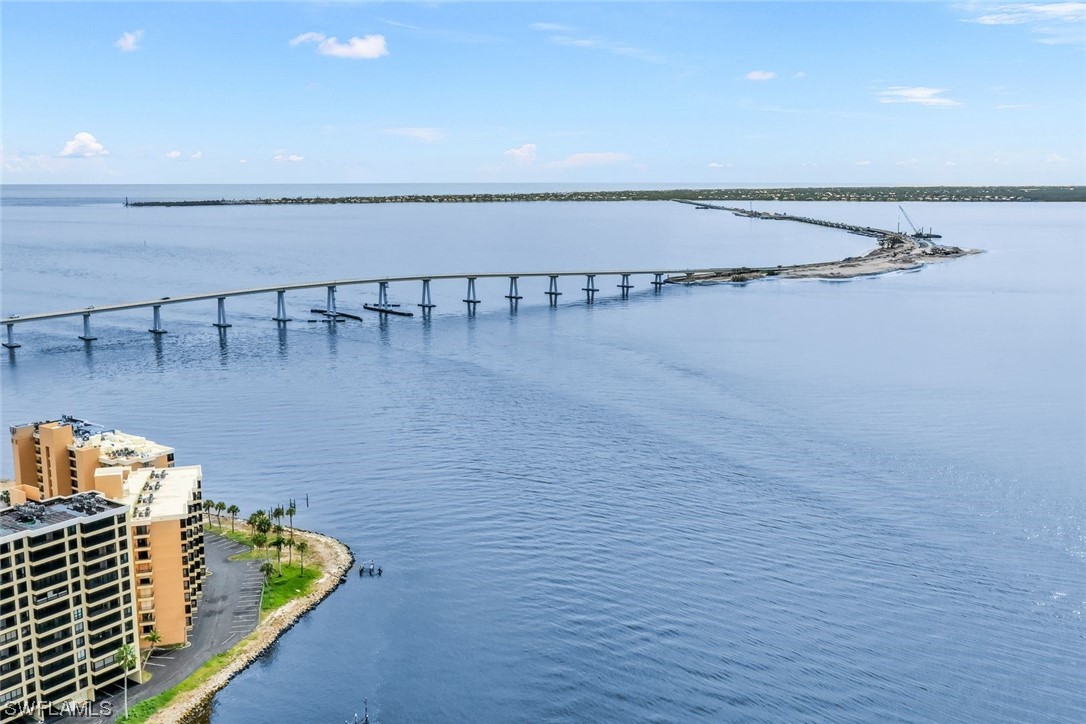 15021 Punta Rassa Road, Unit 504 Fort Myers, FL 33908 - Photo 1 of 24 a terrace with a table and chairs