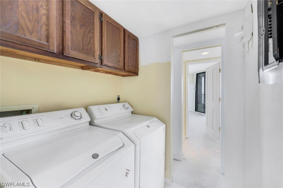 15021 Punta Rassa Road, Unit 504 Fort Myers, FL 33908 - Photo 20 of 24 a utility room with dryer and washer