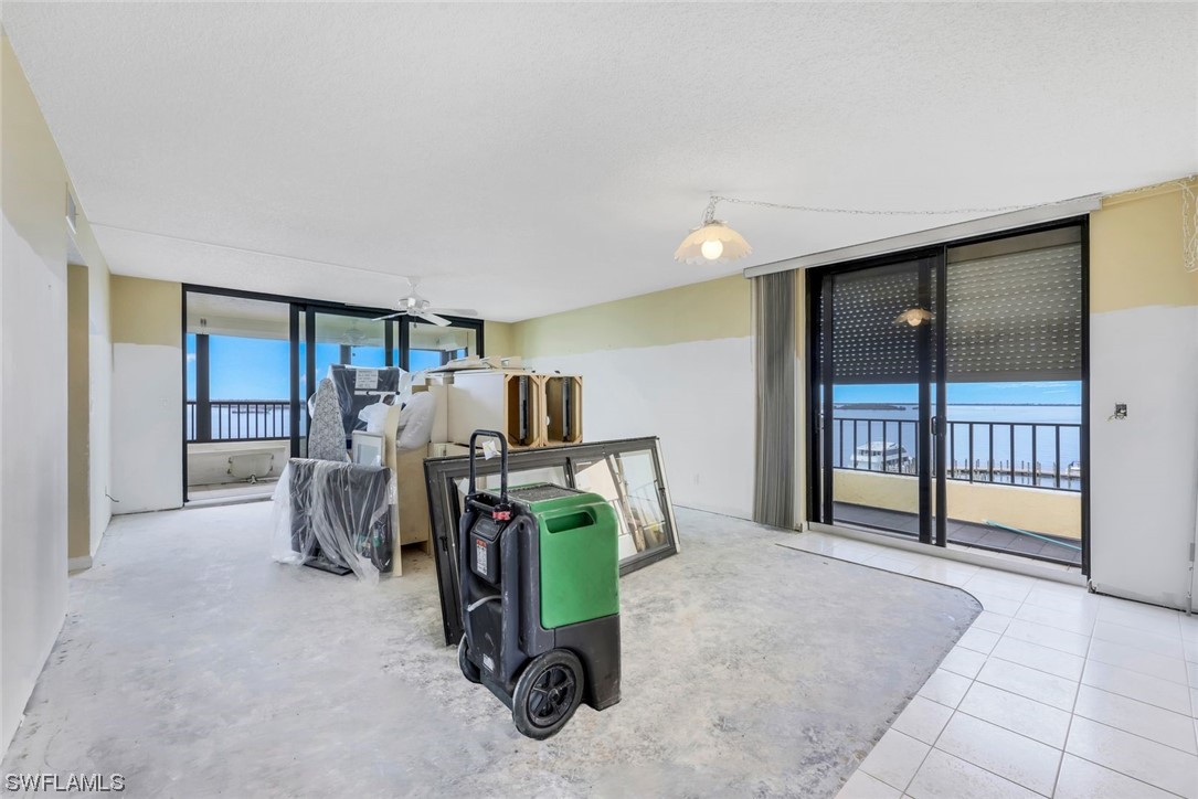 15021 Punta Rassa Road, Unit 504 Fort Myers, FL 33908 - Photo 7 of 24 a view of a room with furniture and a large window