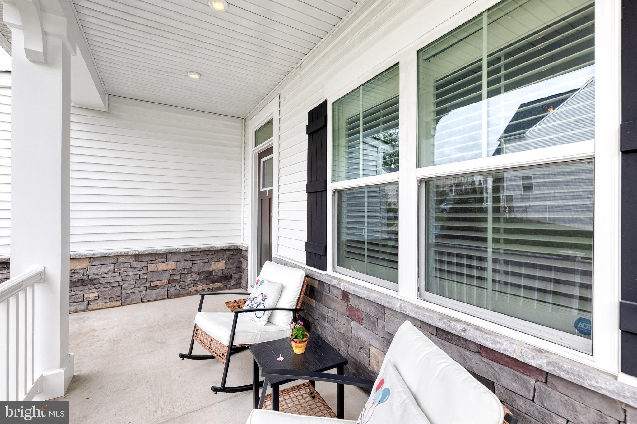 6003 Valentine Way Hanover, MD 21076 - Photo 3 of 52 a view of balcony with two chairs and a large window