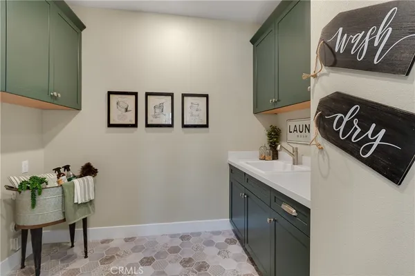 a living room with furniture a clock and a window
