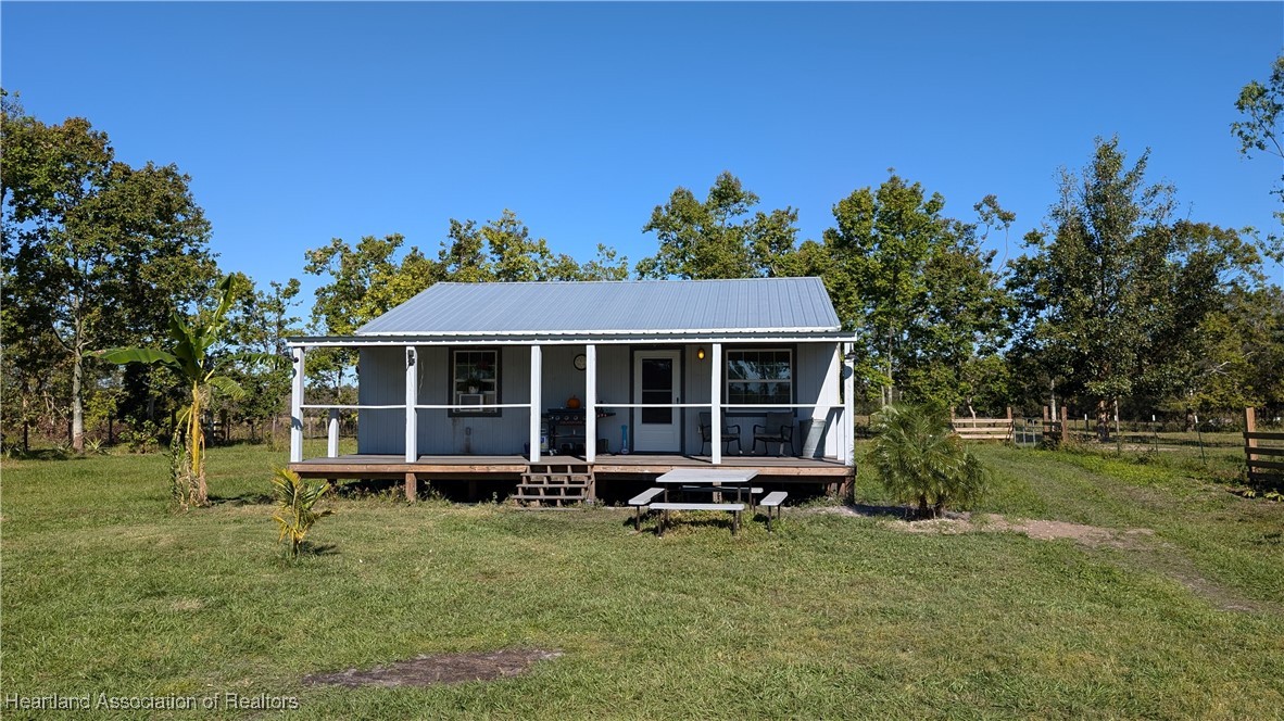 3605 Rabbit Run Road Wauchula, FL 33873 - Photo 26 of 50 front view of a house with a yard