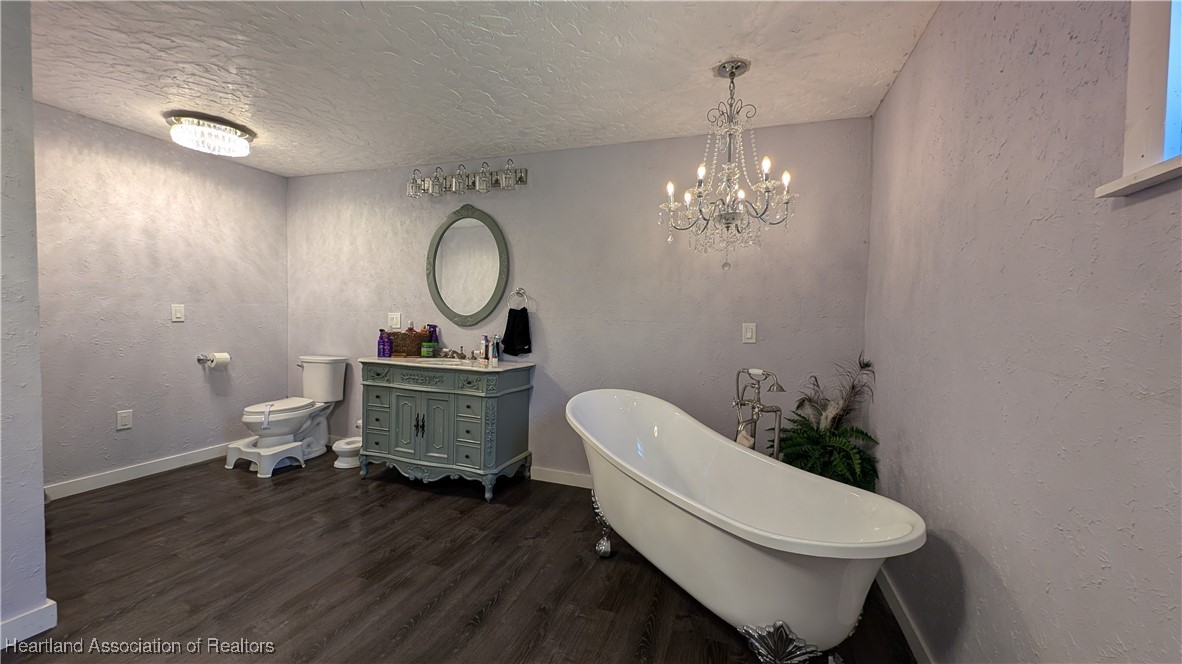 3605 Rabbit Run Road Wauchula, FL 33873 - Photo 33 of 50 a bathroom with a toilet a sink and a mirror