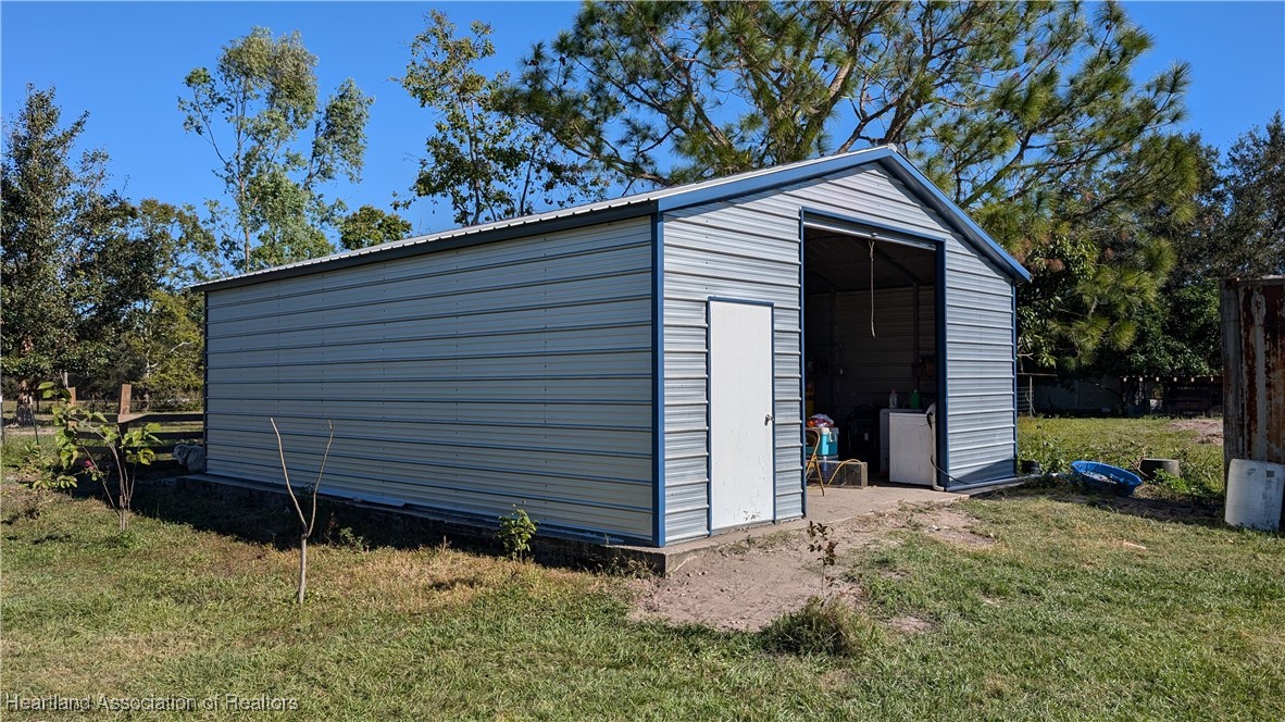 3605 Rabbit Run Road Wauchula, FL 33873 - Photo 40 of 50 a view of a house with a yard