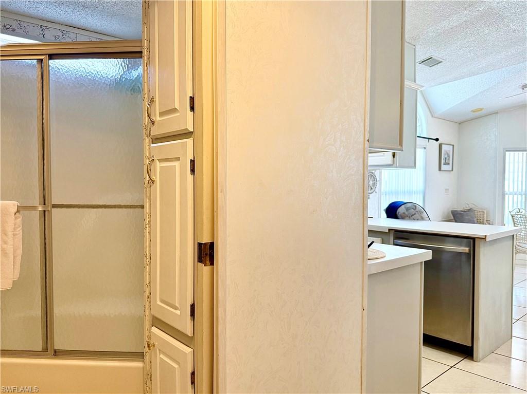 233 Cattleya Refuge, Unit 233 Naples, FL 34114 - Photo 18 of 48 a view of kitchen with washer and dryer