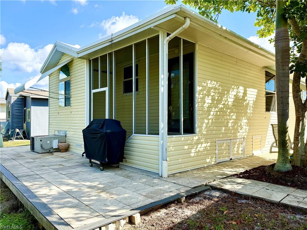 233 Cattleya Refuge, Unit 233 Naples, FL 34114 - Photo 4 of 48 a view of a house with a yard