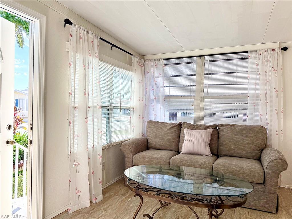 233 Cattleya Refuge, Unit 233 Naples, FL 34114 - Photo 8 of 48 a living room with furniture and a window