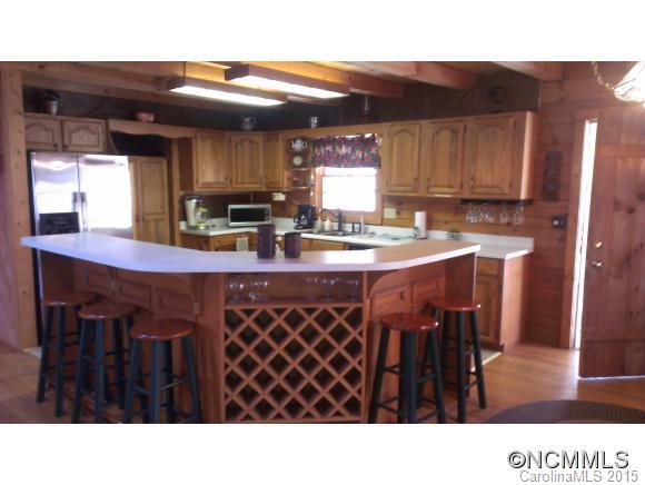 2406 Hemphill Road Waynesville, NC 28785 - Photo 16 of 19 a kitchen with a sink and cabinets
