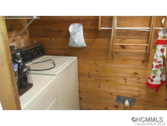 2406 Hemphill Road Waynesville, NC 28785 - Photo 17 of 19 a open kitchen with a sink and a vanity