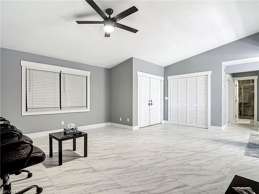 183 Round Key Circle, Unit D4 Naples, FL 34112 - Photo 16 of 49 a view of a livingroom with a workspace & a window
