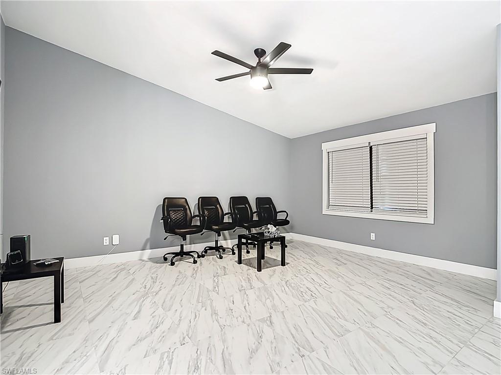 183 Round Key Circle, Unit D4 Naples, FL 34112 - Photo 18 of 49 a workspace with wooden floor