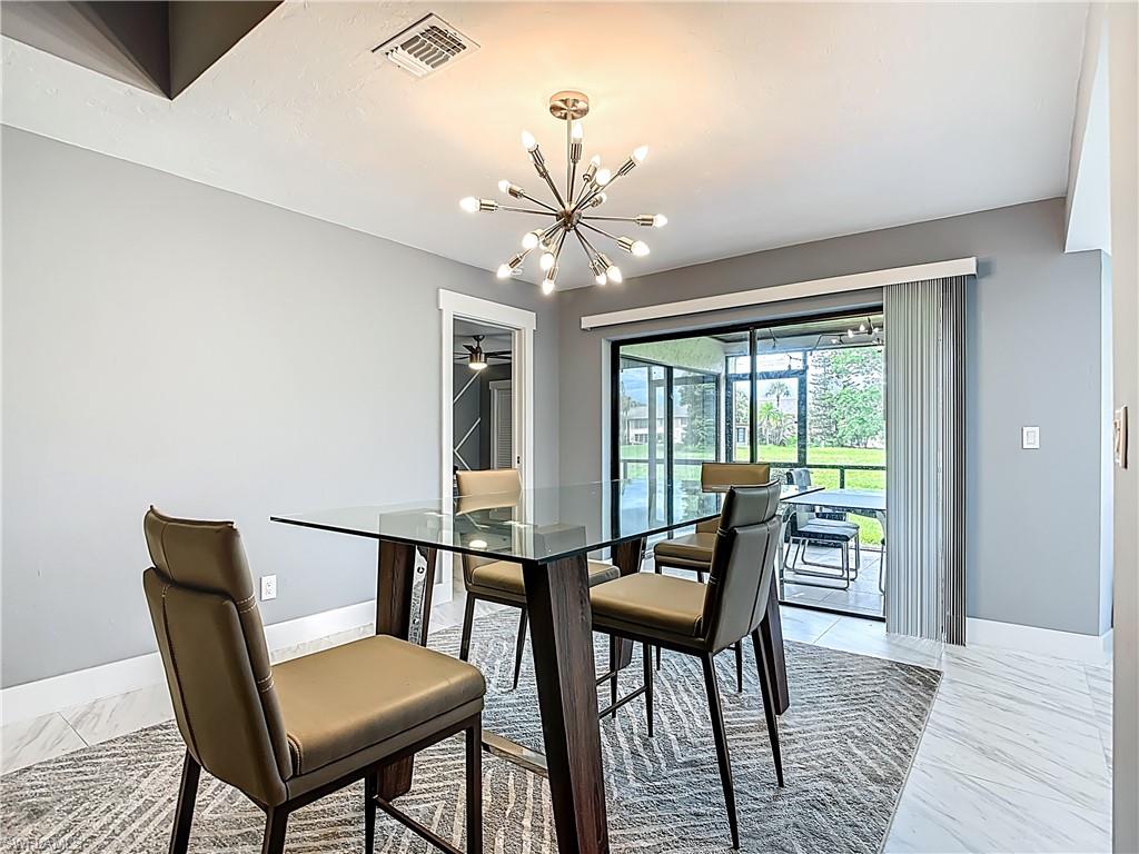 183 Round Key Circle, Unit D4 Naples, FL 34112 - Photo 19 of 49 a view of a dining room with furniture window and wooden floor