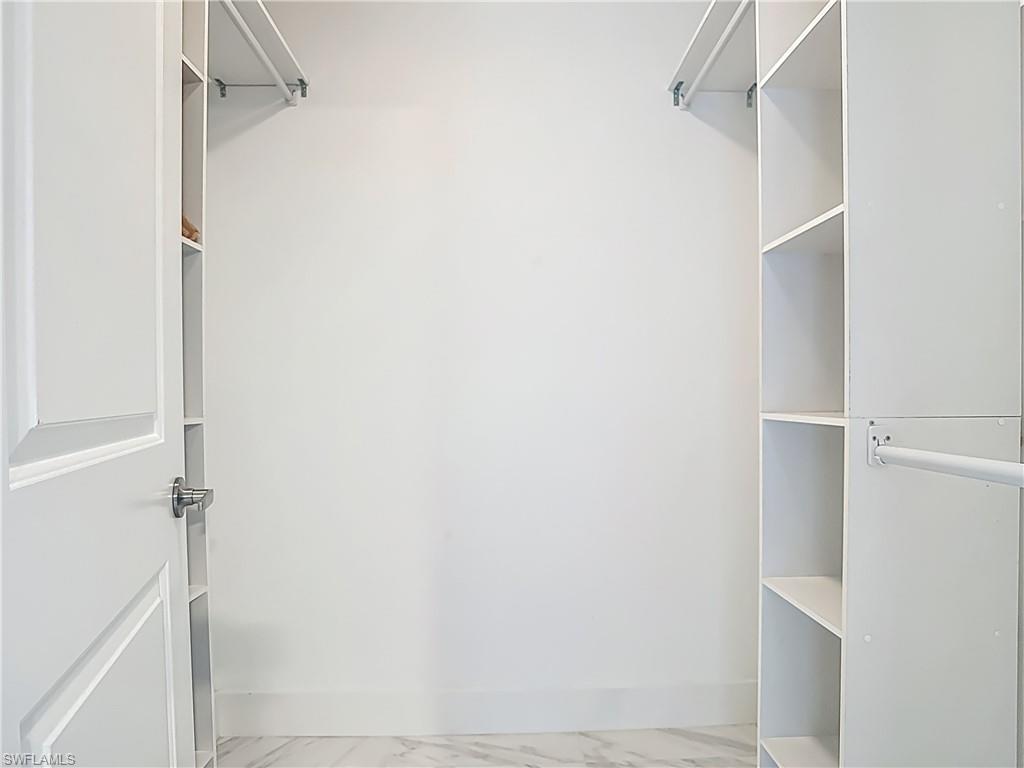 183 Round Key Circle, Unit D4 Naples, FL 34112 - Photo 38 of 49 a view of walk in closet