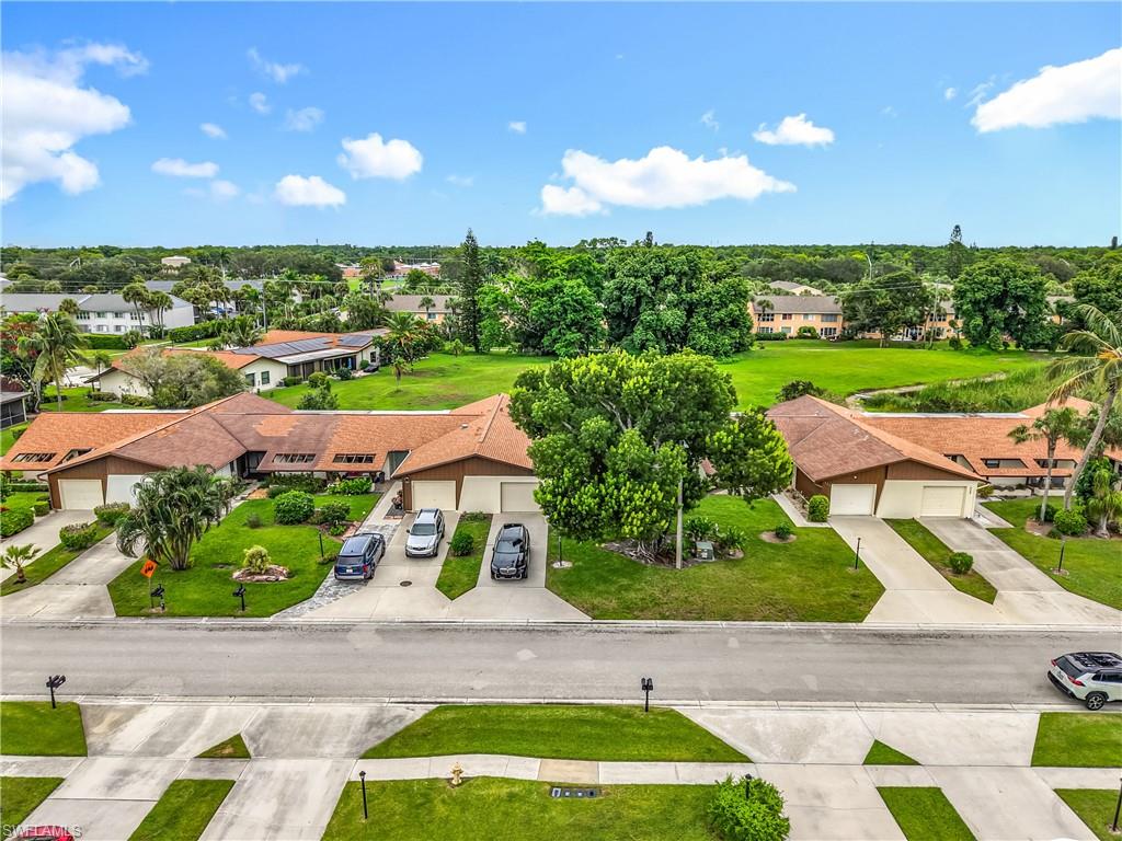 183 Round Key Circle, Unit D4 Naples, FL 34112 - Photo 4 of 49 a view of yard with seating area and green space